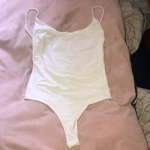 white open back body suit